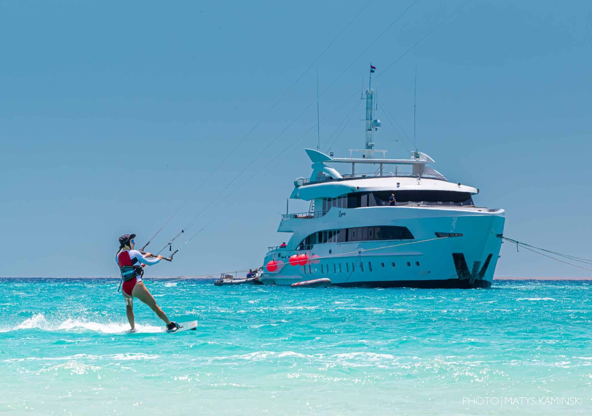 A kitesurfer conquers the waves of the Red Sea on a kiteboard.